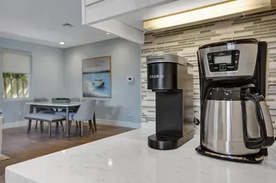 a coffee maker sitting on a counter in a kitchen at Victoria Park Overlook in Fort Lauderdale