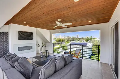 a living room with a couch and a ceiling fan at Victoria Park Overlook in Fort Lauderdale