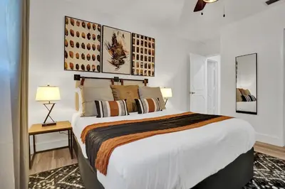 a bedroom with a large bed in a room at Family villa w heated pool gameroom fire pit in Davie