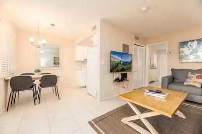 a living room with a couch and a table at The Retreat 3 - Wilton Manors in Fort Lauderdale