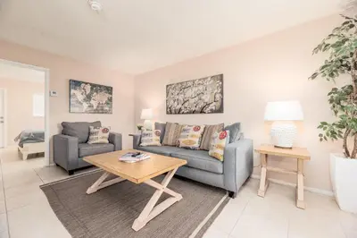 a living room with a couch and a table at The Retreat 3 - Wilton Manors in Fort Lauderdale