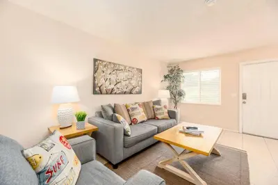 a living room with a couch and a table at The Retreat 3 - Wilton Manors in Fort Lauderdale