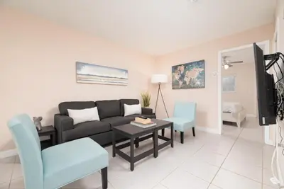 a living room with a couch and a table and chairs at The Retreat 2 - Wilton Manors in Fort Lauderdale