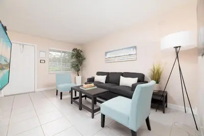 a living room with a couch and a table at The Retreat 2 - Wilton Manors in Fort Lauderdale