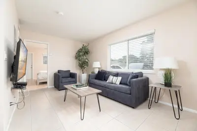 a living room with a couch and a table at The Retreat 1 - Wilton Manors in Fort Lauderdale