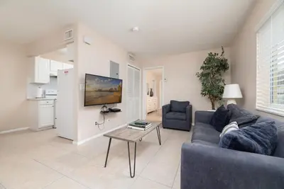 a living room with a couch and a table at The Retreat 1 - Wilton Manors in Fort Lauderdale