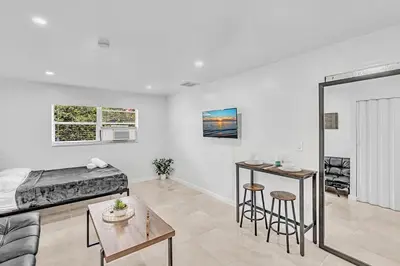 a bedroom with a bed and a table in a room at Hollywood Beach Boutique Vacation Studio LB4 in Hollywood