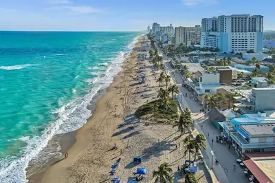 an aerial view of a beach with palm trees and the ocean at Hollywood Beach Boutique Vacation Studio LB4 in Hollywood