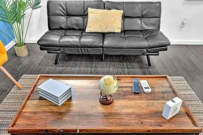 a living room with a leather couch and a coffee table at Hollywood 2 Bdrm Beach Vacation & Hard Rock Sc02 in Hollywood