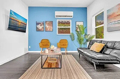 a living room with a couch and two chairs at Hollywood 2 Bdrm Beach Vacation & Hard Rock Sc02 in Hollywood