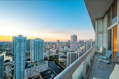 a balcony with a view of a city at Beautiful One Bedroom Condo 16ft ceilings at the W in Miami