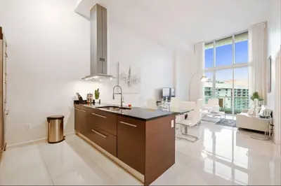 a kitchen with a sink and a counter top at Beautiful One Bedroom Condo 16ft ceilings at the W in Miami