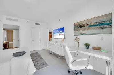 a white office with a desk and a chair at Modern 1 Bed ICON Brickell with Amazing Views in Miami