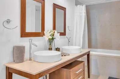 a bathroom with two sinks and a bath tub at Modern 1 Bed ICON Brickell with Amazing Views in Miami