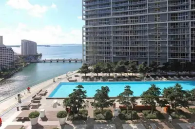 a view of a large swimming pool with a large building at Modern 1 Bed ICON Brickell with Amazing Views in Miami