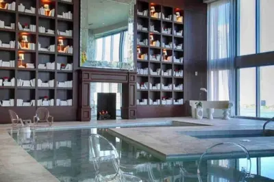 a swimming pool in a room with a fireplace at Modern 1 Bed ICON Brickell with Amazing Views in Miami