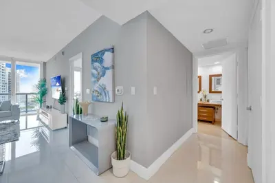 a white living room with a potted plant at Modern 1 Bed ICON Brickell with Amazing Views in Miami