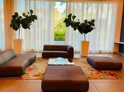 a living room with a couch and chairs and a table at Relax by the Sea in This Cozy Beachfront Room 908B in Hallandale Beach