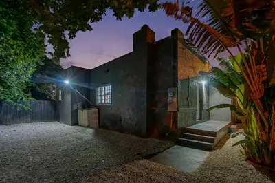 an outside view of a house at night at River House 4BR, Pool/Hot Tub in Miami