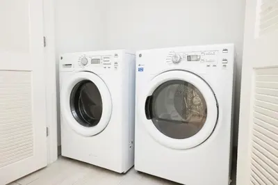 two white washing machines sitting next to each other at Diamond In The Sky in Hollywood