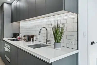 a kitchen with a sink and a faucet at - Casiola Studio's - near Cruise Terminal, Bayfront Park and Kaseya Center in Miami
