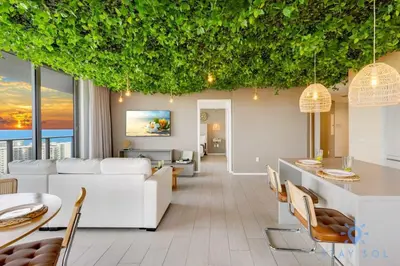 a living room with white furniture and plants on the ceilings at Jungle Experience, High Floor, Pools in Hollywood