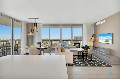 a living room with a couch and a table at HighFloor with Stunning Views, Pools, Near Beach in Hollywood