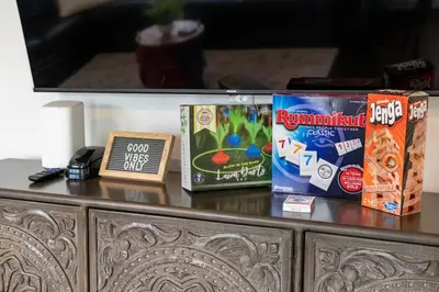 a table with snacks on top of a dresser at Victoria Park Oasis with Heated Pool and More in Fort Lauderdale