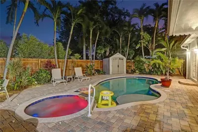 a swimming pool with a toy in the middle at Chic Victoria Park Villa with Heated Pool and Spa in Fort Lauderdale