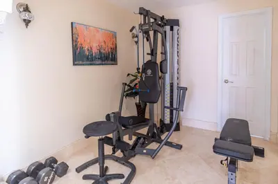 a room with a gym with a weight machine at Oceana Blue / Beach Front / Pool / Bar / Relax in Fort Lauderdale