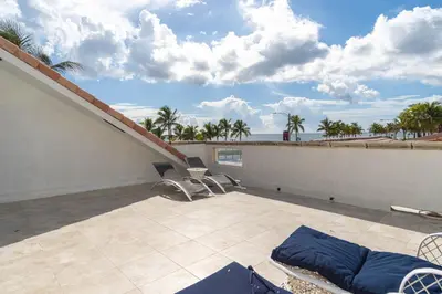 a balcony with a patio with a view of the ocean at Oceana Blue / Beach Front / Pool / Bar / Relax in Fort Lauderdale