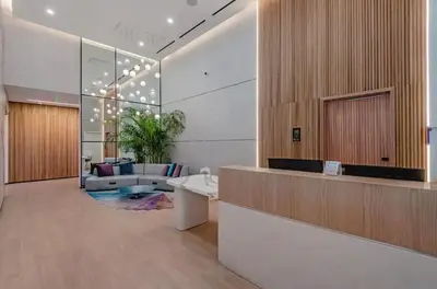a lobby with a reception desk and a living room at Exceptional Studio with King Bed and Queen Sofa-bed in Miami