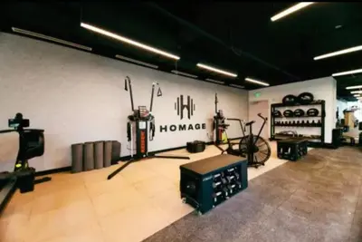 a room with a gym with bikes on a wall at Exceptional Studio with King Bed and Queen Sofa-bed in Miami