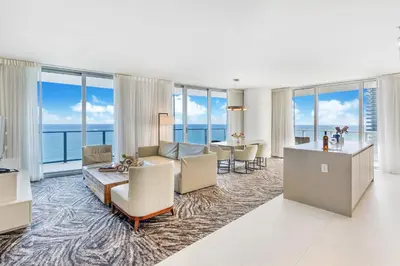 a living room with a view of the ocean at Ocean Front Paradiiise 3 Bedroom by Zen in Hollywood