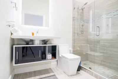 a bathroom with a sink and a toilet and a shower at Ocean view Work from Home Balcony Parking Pool in Miami