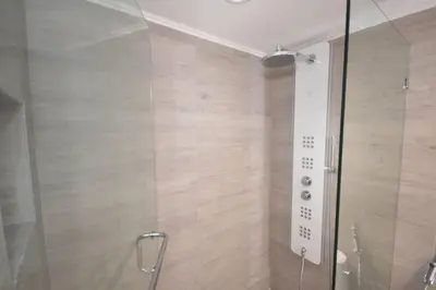 a shower with a glass door in a bathroom at LUXURY CONDO LOCATED iN THE HEART OF MIAMI in Miami