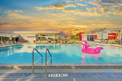 a pool with a pink flamingo in the water at Rooftop Pool - Ocean View Balcony - Hollywood Beach in Hollywood