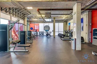 a gym with lots of treadmills and cardio machines at Rooftop Pool - Ocean View Balcony - Hollywood Beach in Hollywood