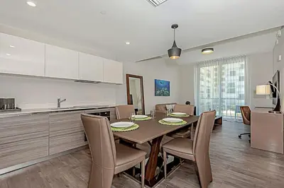 a kitchen and dining room with a table and chairs at Rooftop Pool - Ocean View Balcony - Hollywood Beach in Hollywood