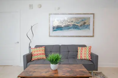a living room with a couch and a coffee table at 2Bed 2 Bath Airbnb Friendly building with Pool, Hot Tub, and Gym in Miami