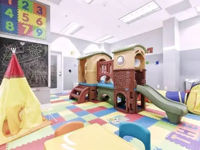 a childs room with a play area with play equipment at 2 Bedroom, 2 Bathroom plus Den Brickell Condo Pool, Hot Tub, and Gym in Miami