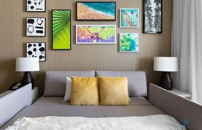 a living room with a couch and pictures on the wall at Ocean View Balcony, Beachfront Resort, Pools, Gym in Hollywood