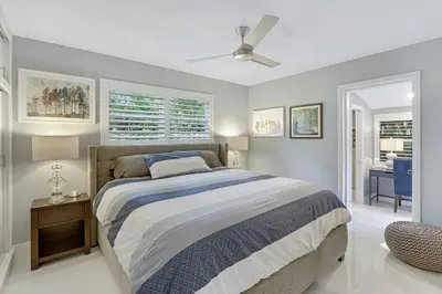 a bedroom with a bed and a ceiling fan at Modern 2BRHouse in Wilton Manors with a Heated Pool and KING Bed in Fort Lauderdale