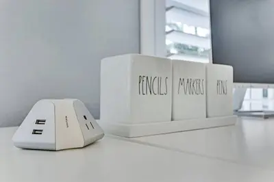 a computer mouse sitting on a desk next to three white controllers at Modern 2BRHouse in Wilton Manors with a Heated Pool and KING Bed in Fort Lauderdale