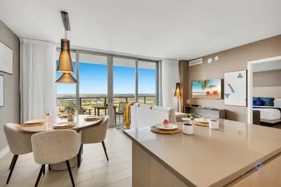 a kitchen and living room with a table and chairs at Amazing Pools - Bay View - Parking Included in Hollywood
