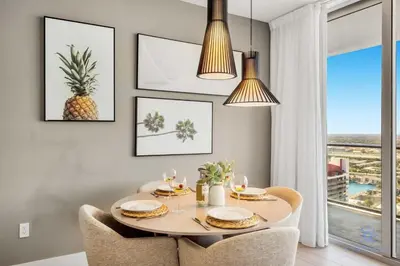 a dining room with a table and chairs and a window at Amazing Pools - Bay View - Parking Included in Hollywood