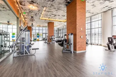 a gym with treadmills and cardio equipment in a building at Amazing Pools - Bay View - Parking Included in Hollywood