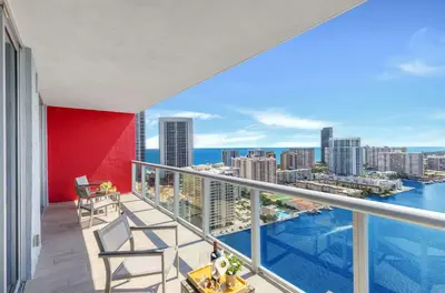 an apartment balcony with a view of the city at Balcony with View, Pool, Gym, Near Beach in Hallandale Beach