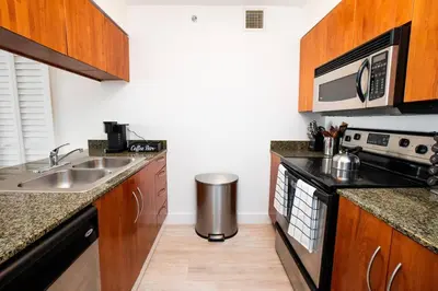 a kitchen with a sink and a stove at City views at brickell miami in Miami