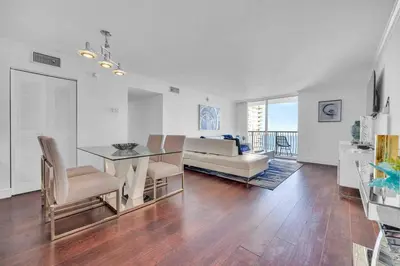 a living room with a table and a couch at Central ocean view 3 bedrooms in Miami W Parking in Miami